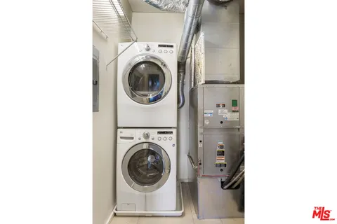 a view of a hallway with washer and dryer