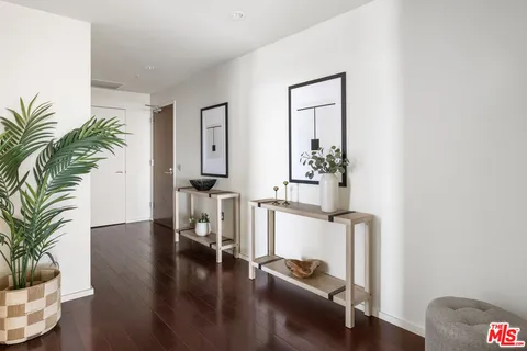 a view of a room with gym equipment and a table