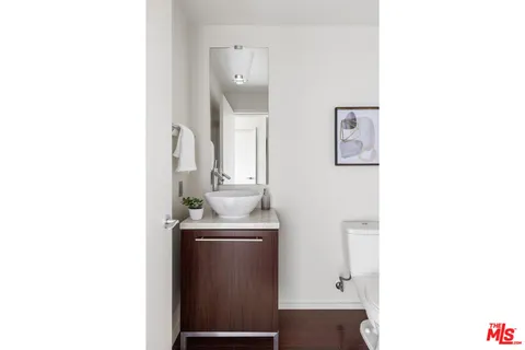 a room with a sink and a mirror