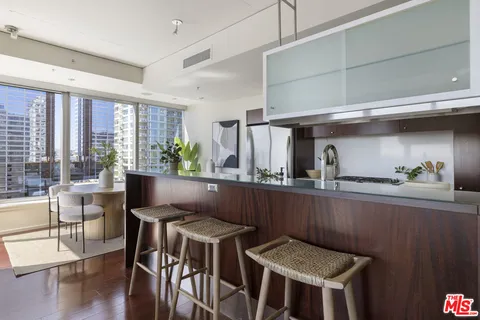 a kitchen with a table and chairs in it