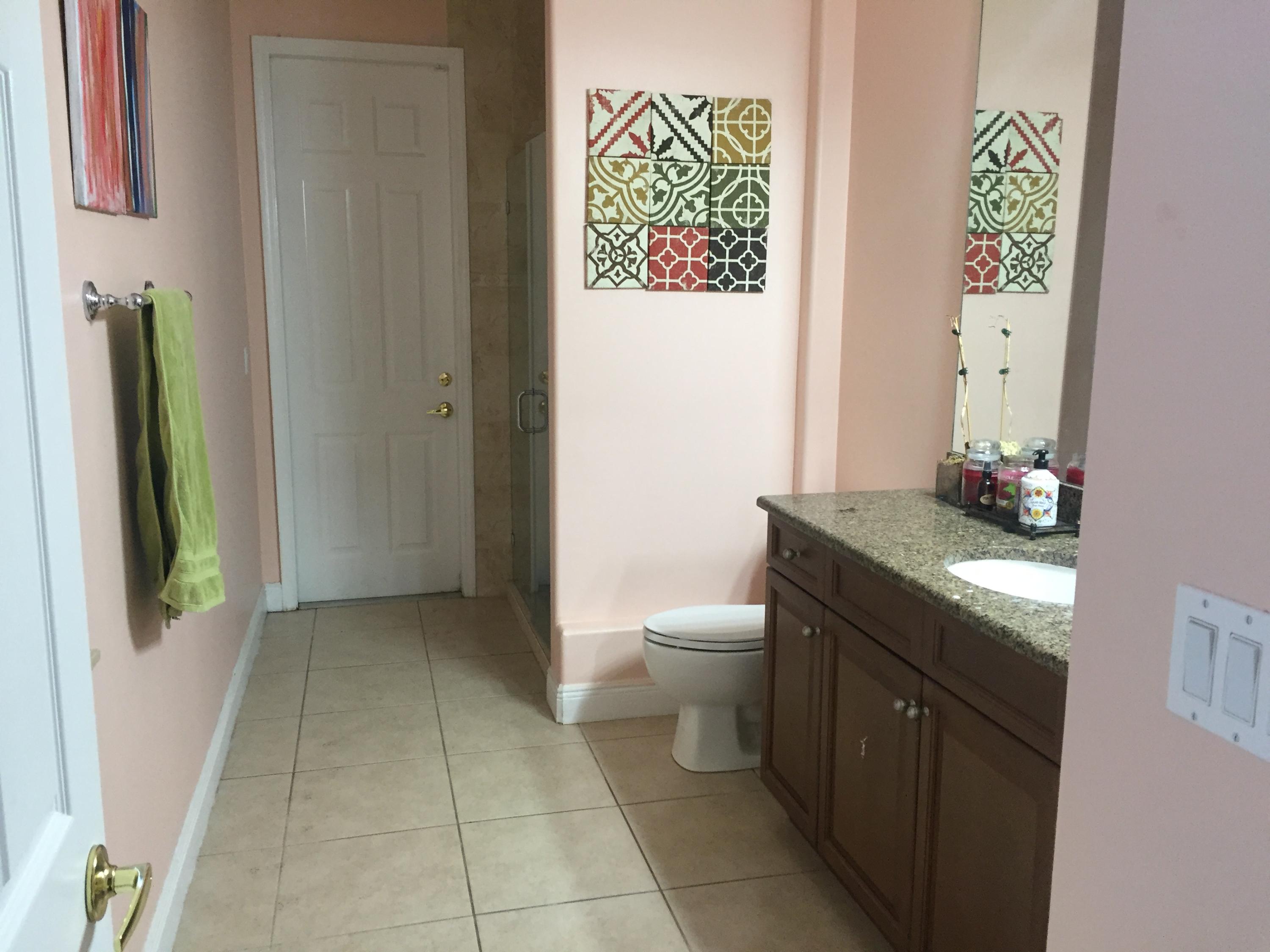 602 Southwest Dairy Road Port St. Lucie, FL 34953 - Photo 17 of 26 Bathroom 3 outside separate entrance