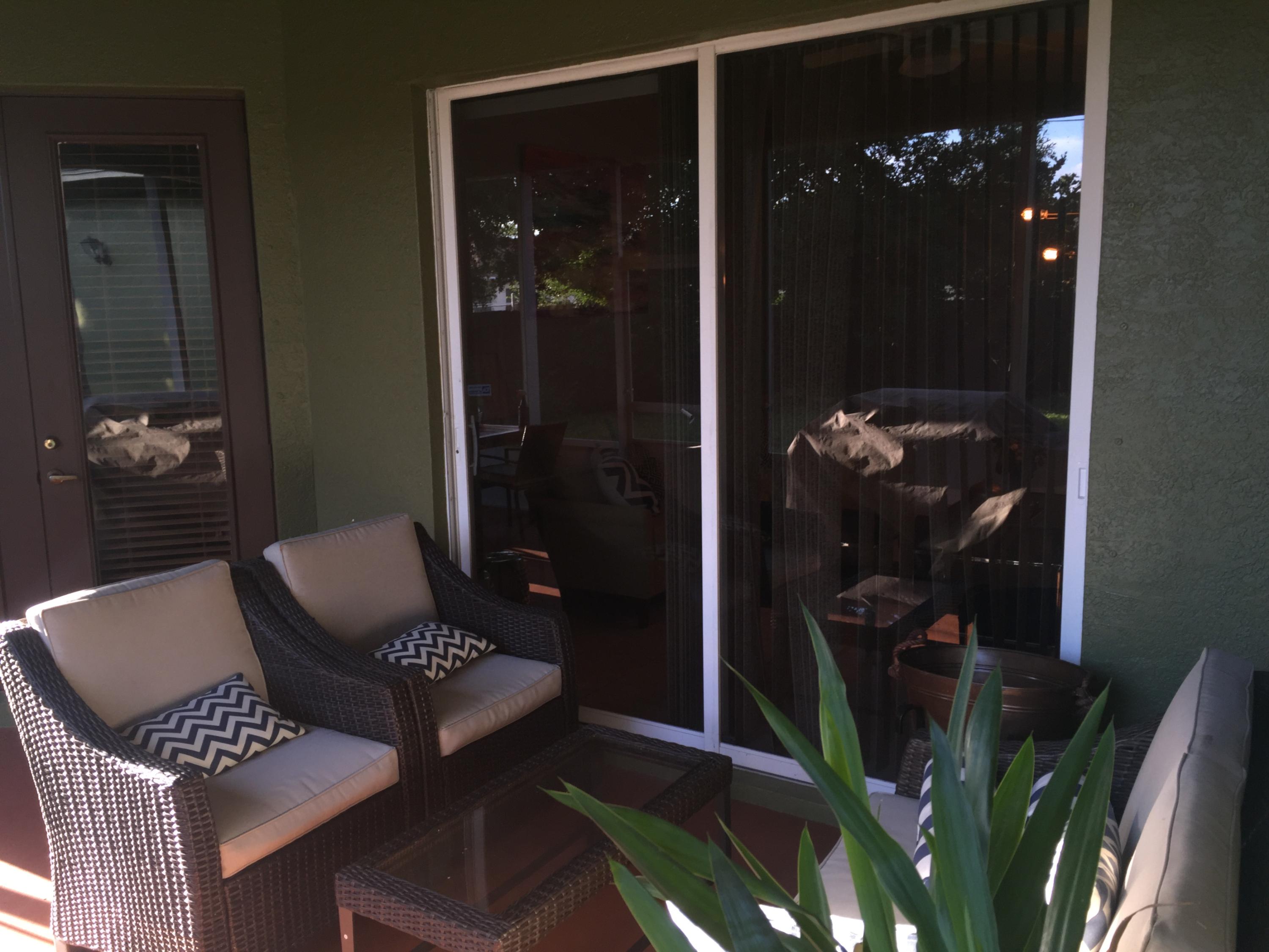 602 Southwest Dairy Road Port St. Lucie, FL 34953 - Photo 22 of 26 Screened porch Living Room sliders
