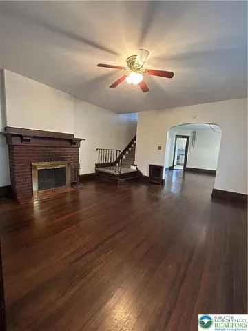 a view of a livingroom with furniture and a fireplace