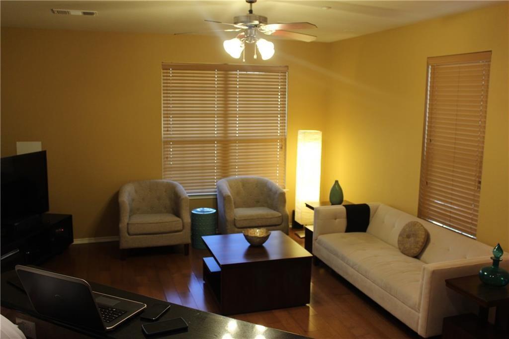 1310 West Parmer Lane, Unit 1503 Austin, TX 78727 - Photo 15 of 26 Living room featuring dark wood finished floors and a ceiling fan