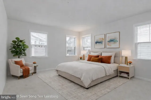 a bedroom with bed and a couch