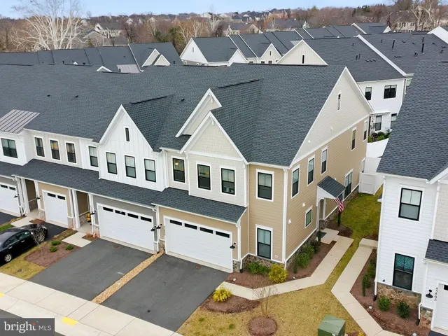 an aerial view of residential houses with an outdoor space