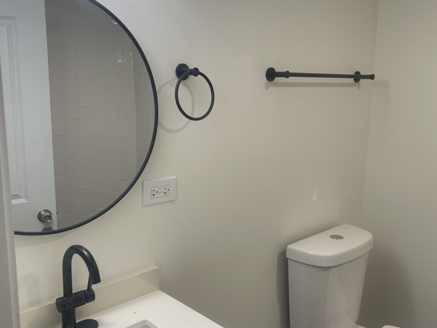 654 West 111th Street Chicago, IL 60628 - Photo 19 of 22 a bathroom with a sink a toilet and a mirror