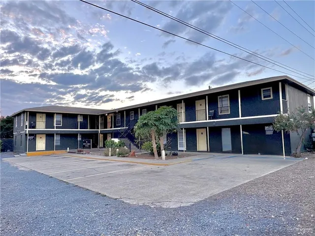 a front view of a house with large windows