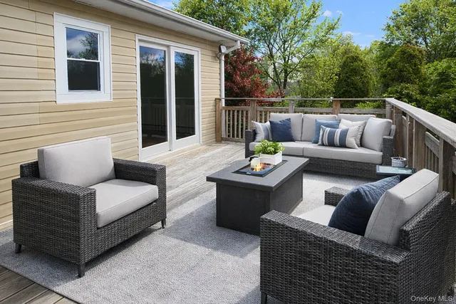 a balcony with furniture and outdoor view