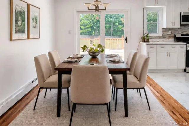 a dining room with furniture and window