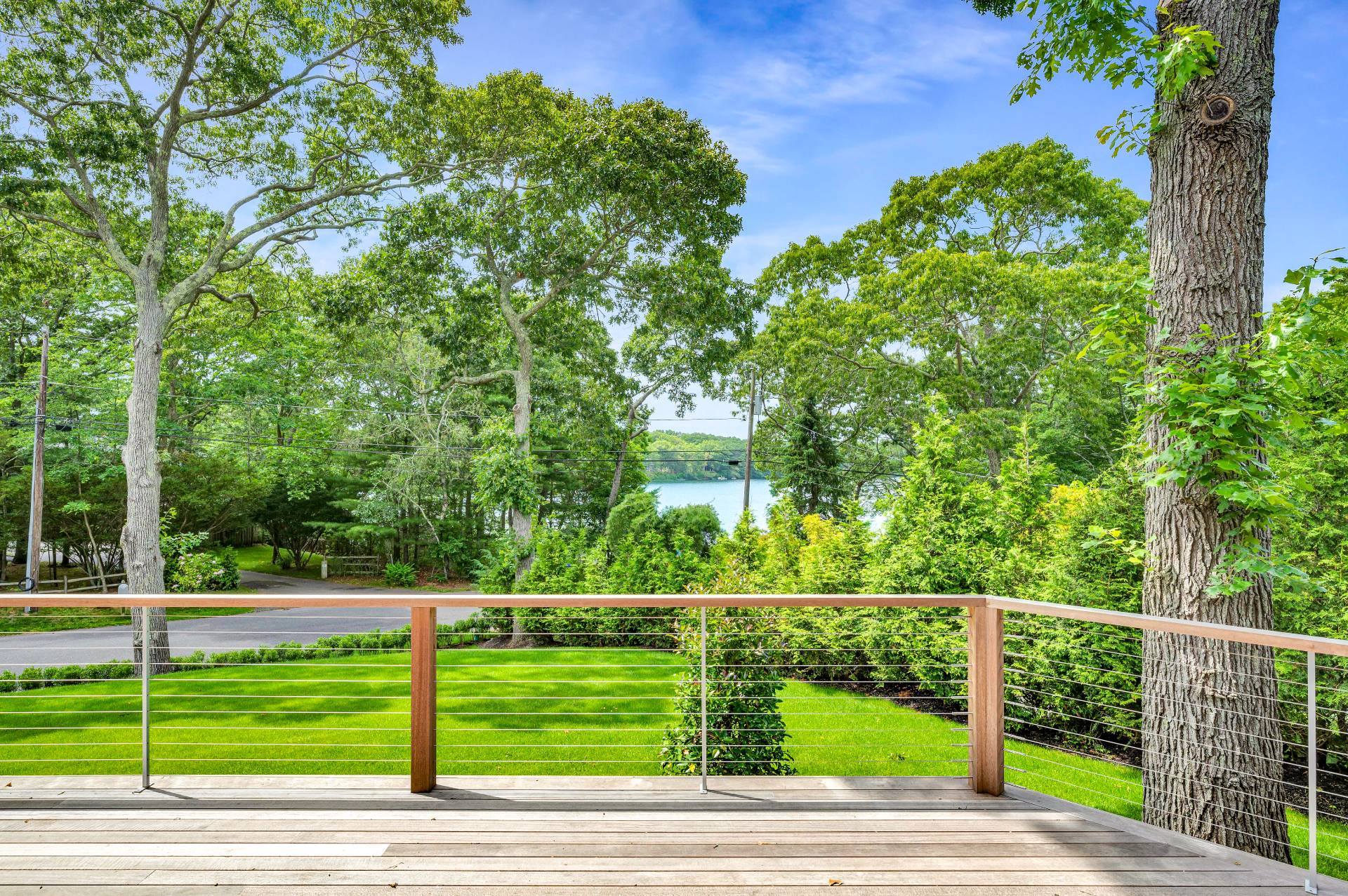 138 Big Fresh Pond Road Southampton, NY 11968 - Photo 12 of 43 a view of a yard and deck
