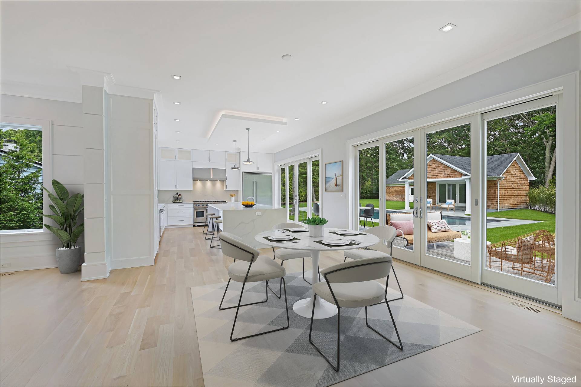 138 Big Fresh Pond Road Southampton, NY 11968 - Photo 15 of 43 a view of a dining room with furniture window and outside view