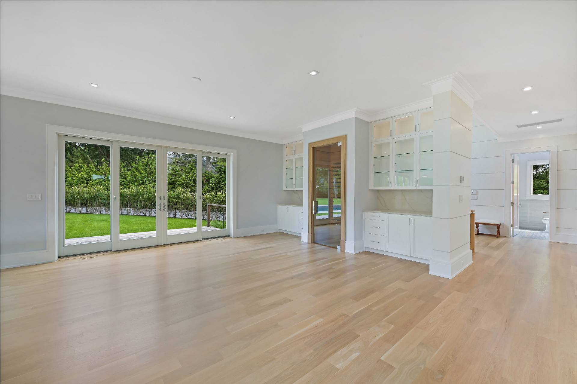 138 Big Fresh Pond Road Southampton, NY 11968 - Photo 19 of 43 a view of an empty room with a window and cabinet
