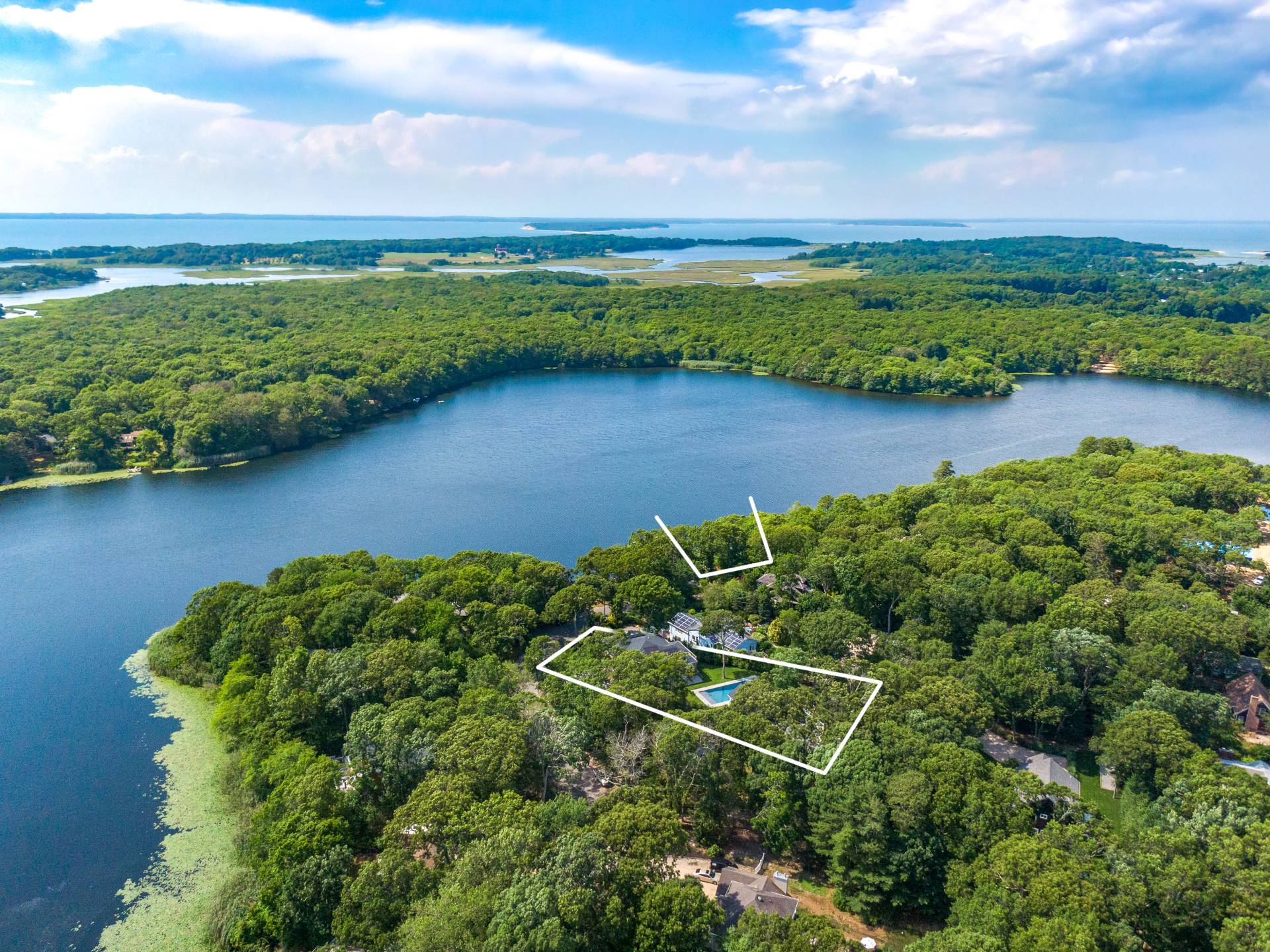 138 Big Fresh Pond Road Southampton, NY 11968 - Photo 2 of 43 an aerial view of a garden with houses