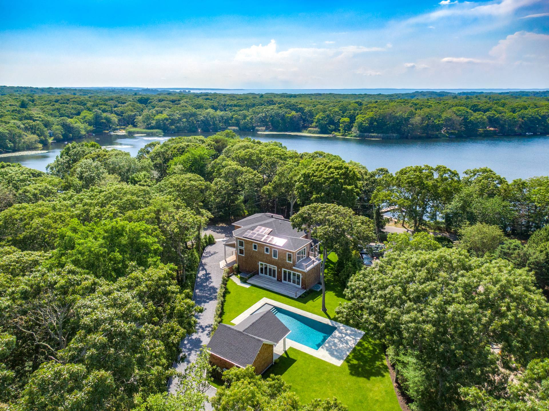 138 Big Fresh Pond Road Southampton, NY 11968 - Photo 4 of 43 an aerial view of a house with lake view
