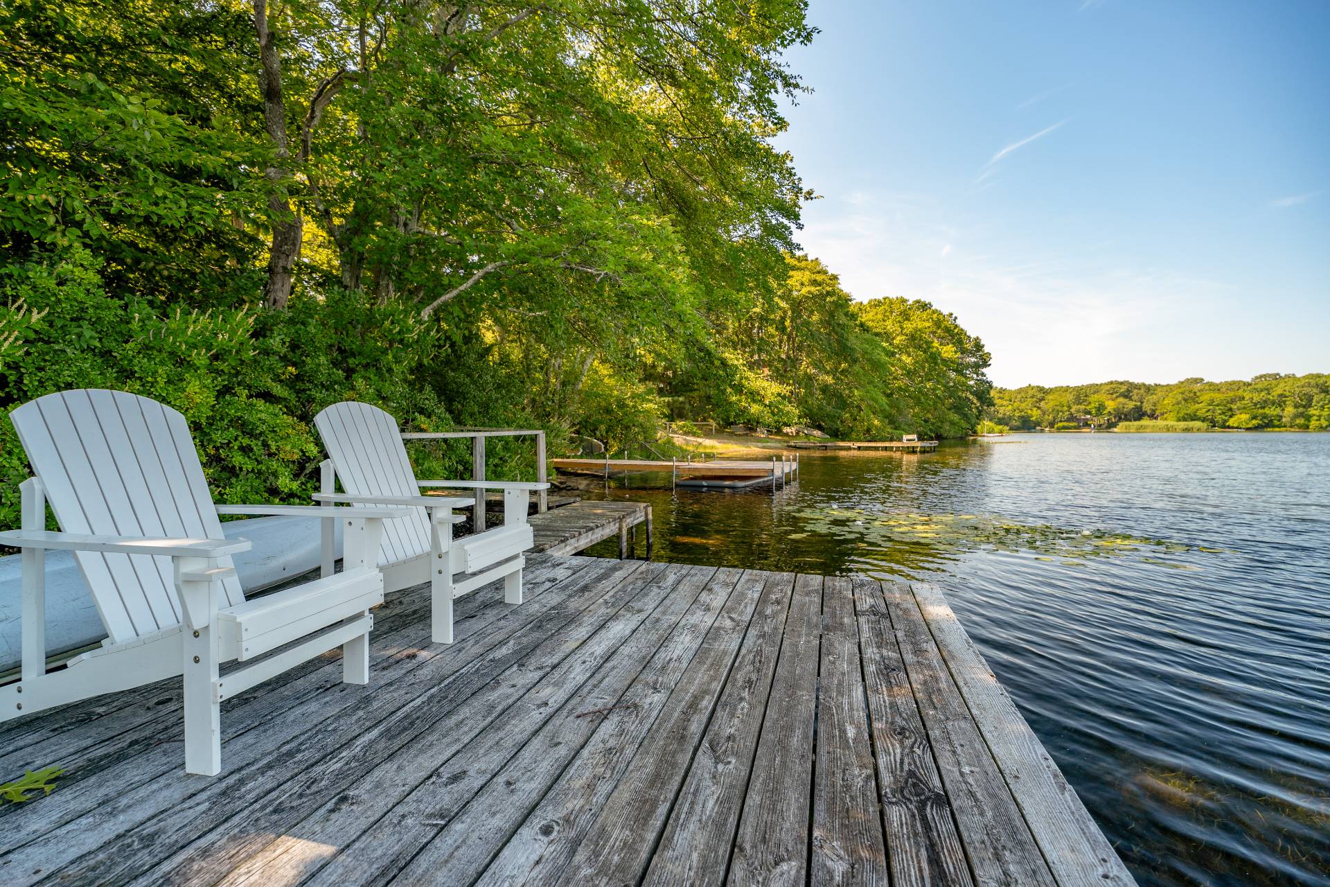 138 Big Fresh Pond Road Southampton, NY 11968 - Photo 42 of 43 a view of deck with seating space and trees