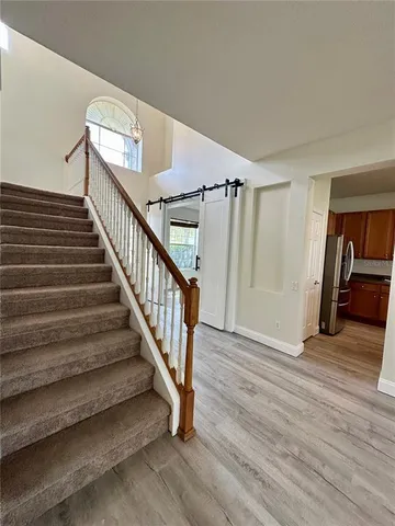a view of an entryway with wooden floor