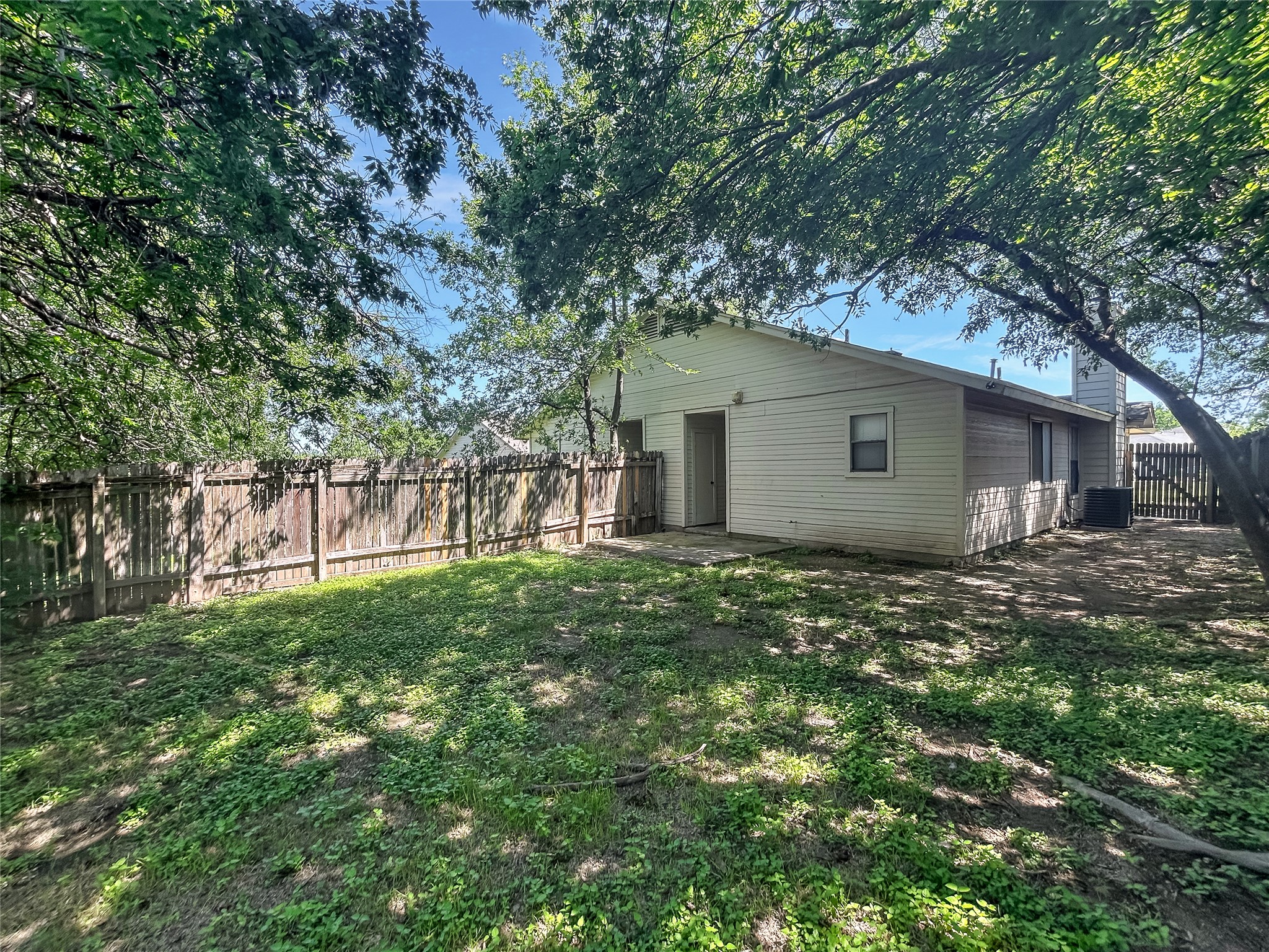 2008 Alex Avenue, Unit A Austin, TX 78728 - Photo 20 of 22 Backyard with a Covered Wooden Fence