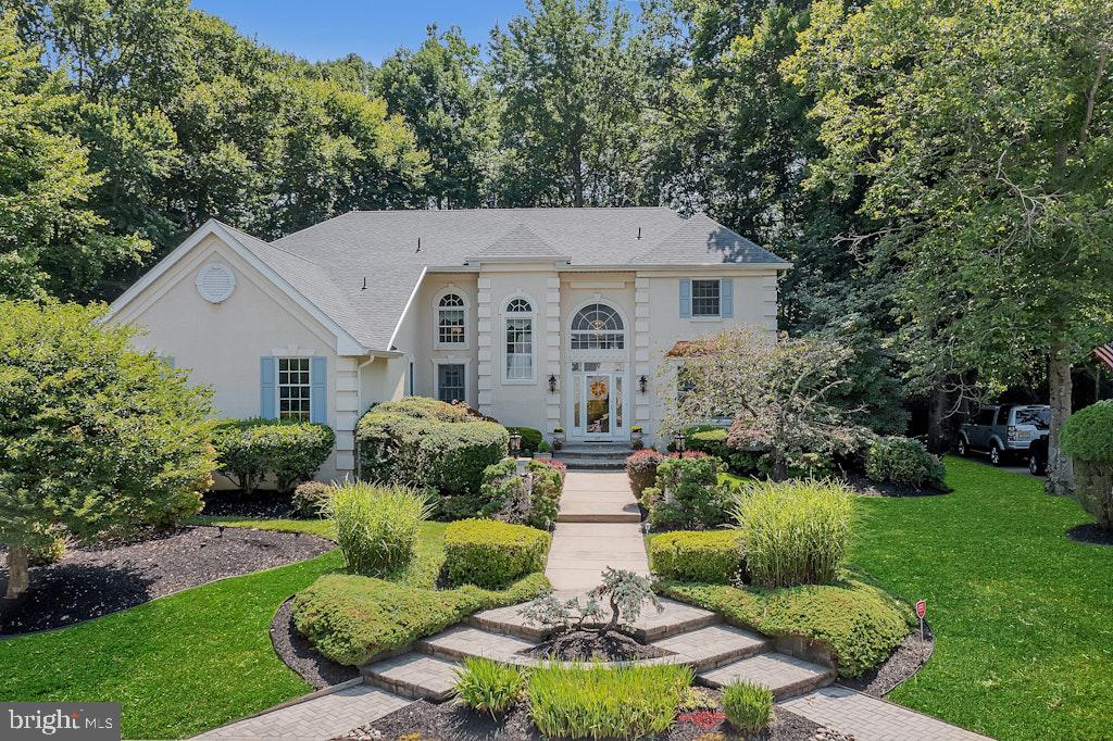 17 Stanwyck Road Mount Laurel, NJ 08054 - Photo 2 of 56 Charming home embraced by lush greenery.