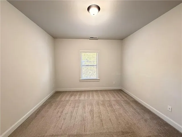 a view of empty room with fan
