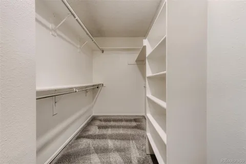 a view of an empty walk in closet