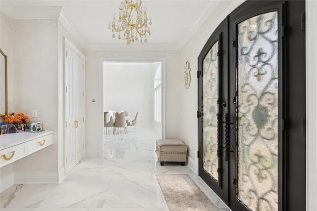 a view of a hallway with bathroom and shower