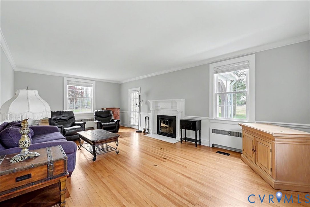 2800 Nottoway Boulevard Victoria, VA 23974 - Photo 21 of 45 Living room with radiator, light wood-type floorin