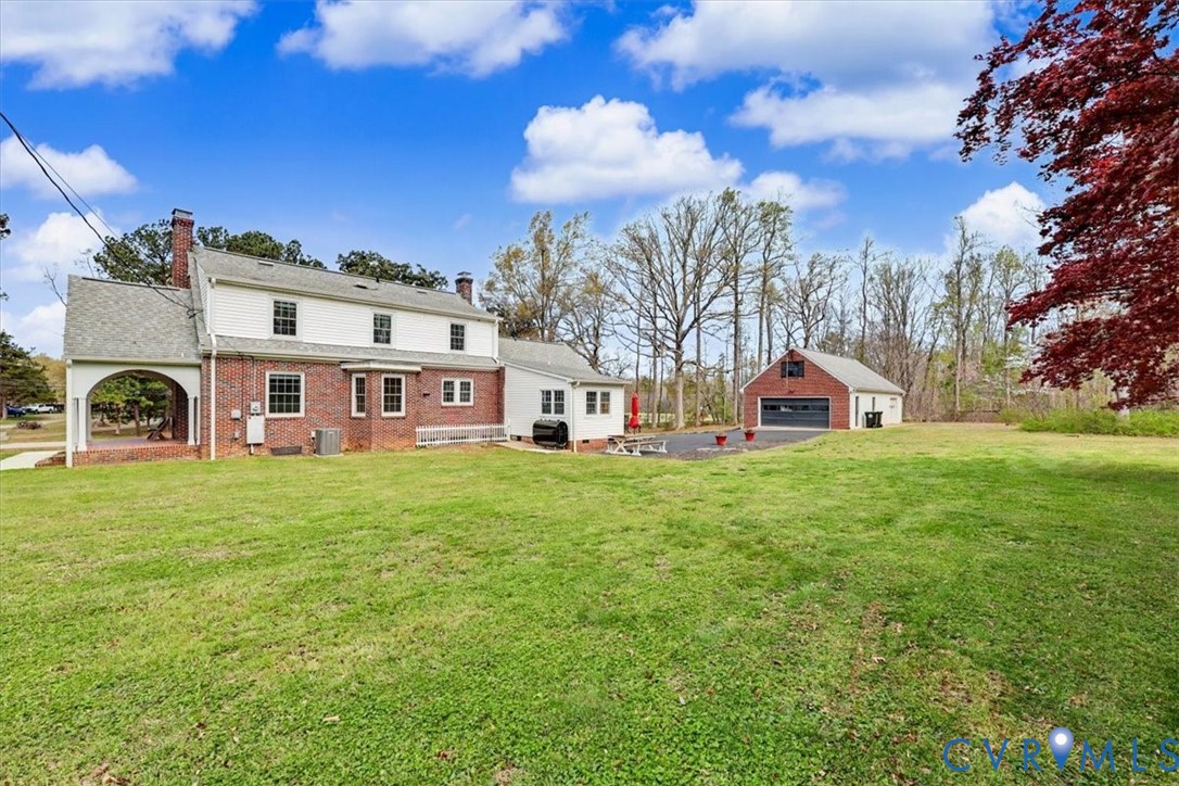 2800 Nottoway Boulevard Victoria, VA 23974 - Photo 39 of 45 Rear view of property featuring a chimney, an outb