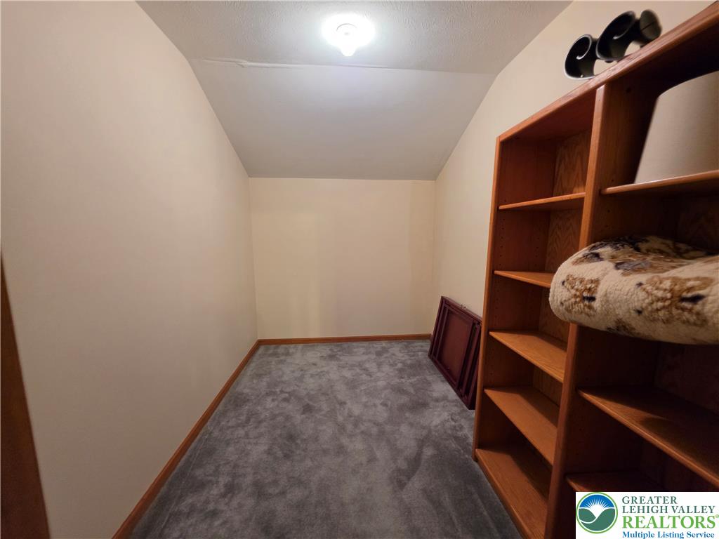 211 Murphy Circle Bushkill, PA 18324 - Photo 13 of 28 Functional closet space, thoughtfully designed with built-in shelving, offers organized storage.