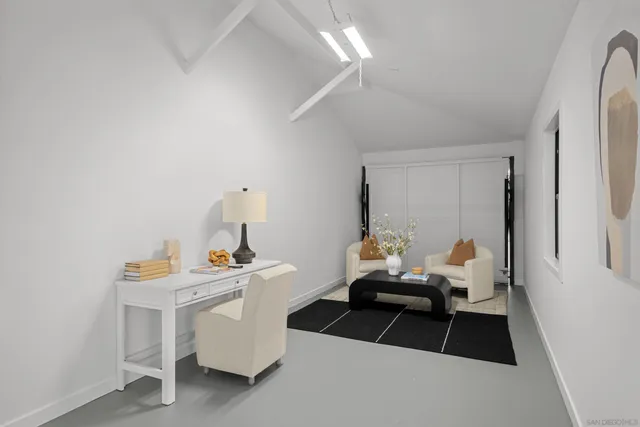 a room with furniture and white walls