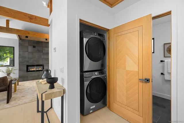 a view of a hallway with washer and dryer