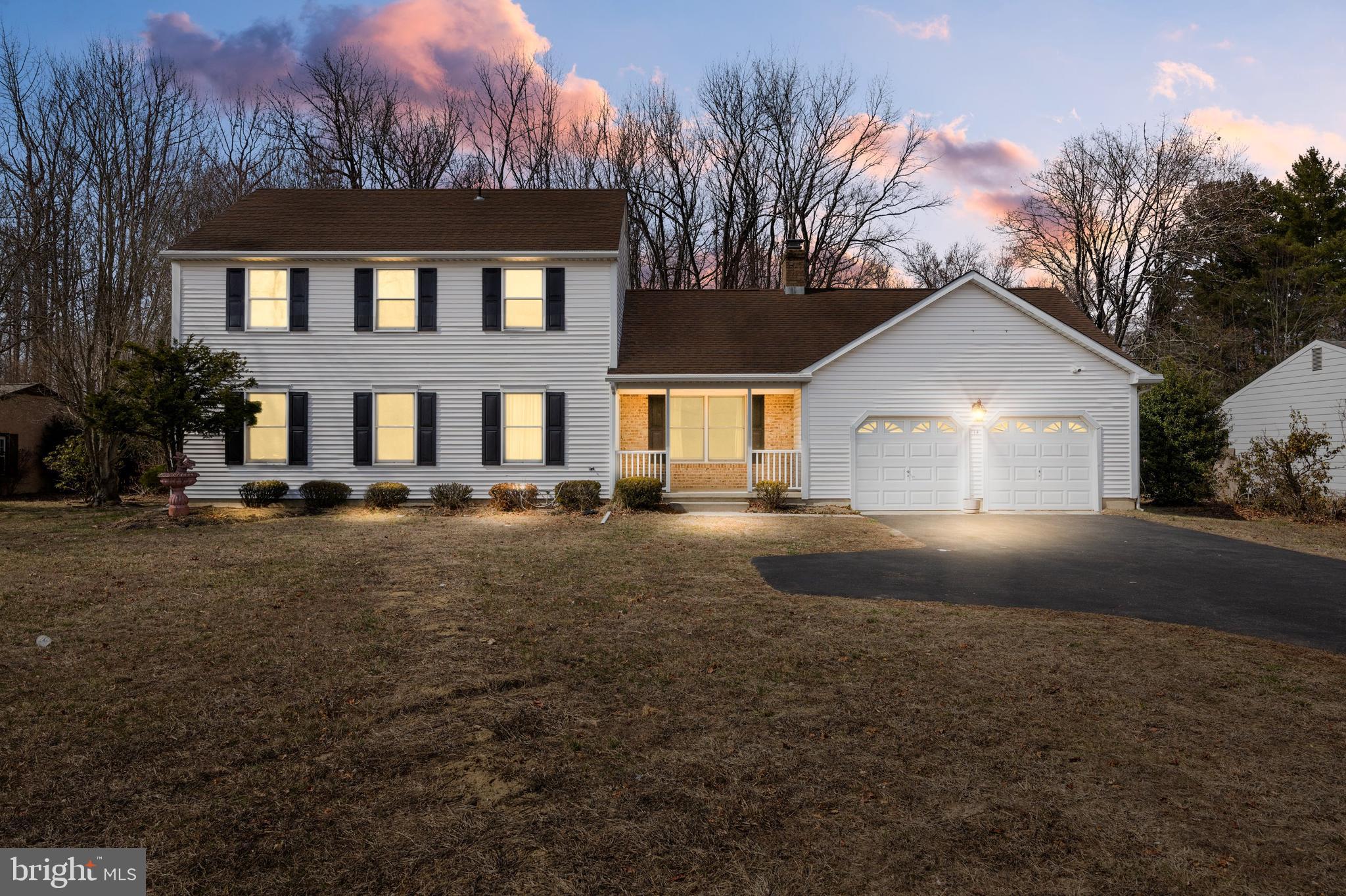 14 Taunton Road Medford, NJ 08055 - Photo 1 of 47 a front view of a house with a yard