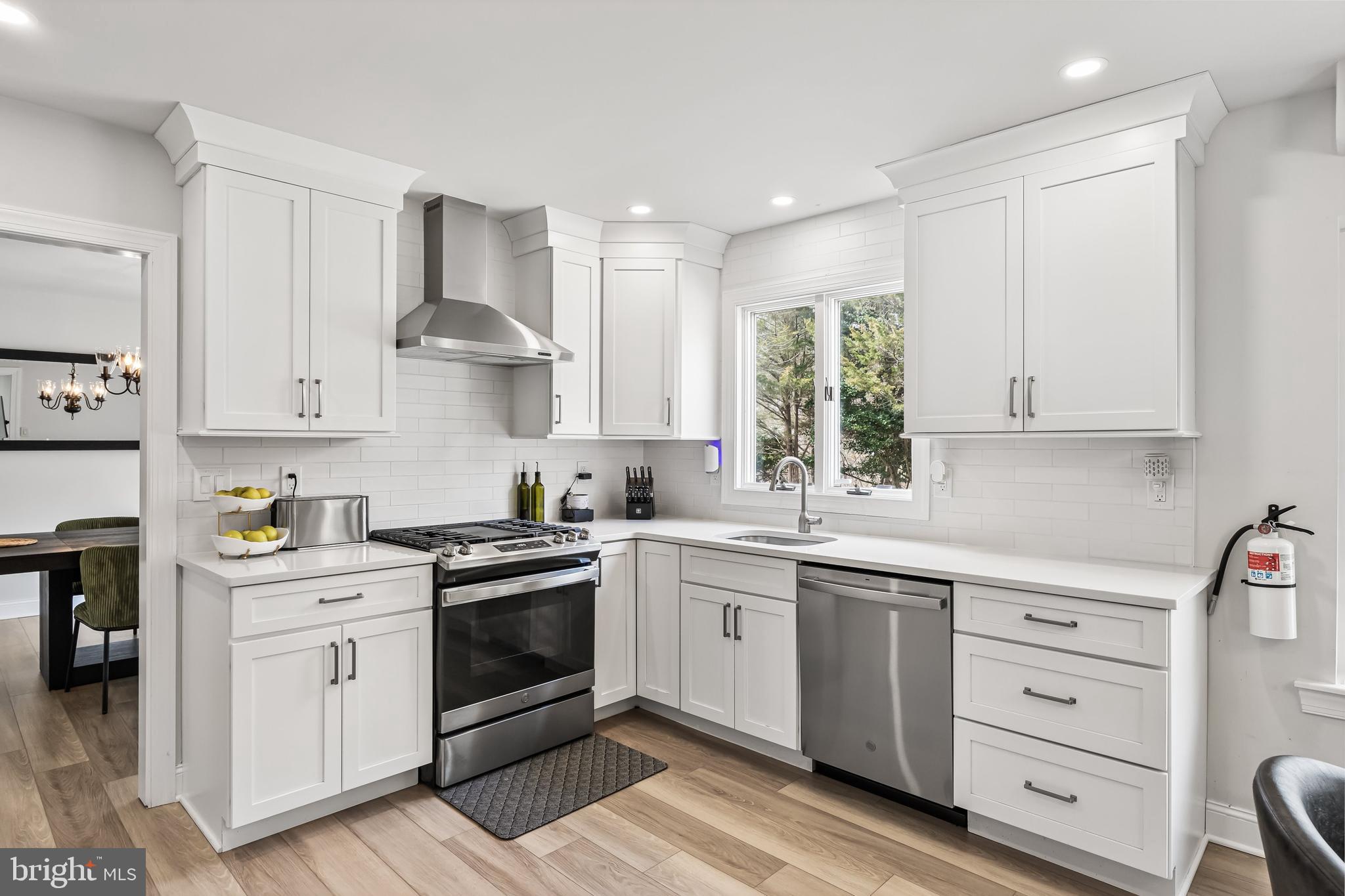 14 Taunton Road Medford, NJ 08055 - Photo 19 of 47 a kitchen with white cabinets stainless steel appliances and a window