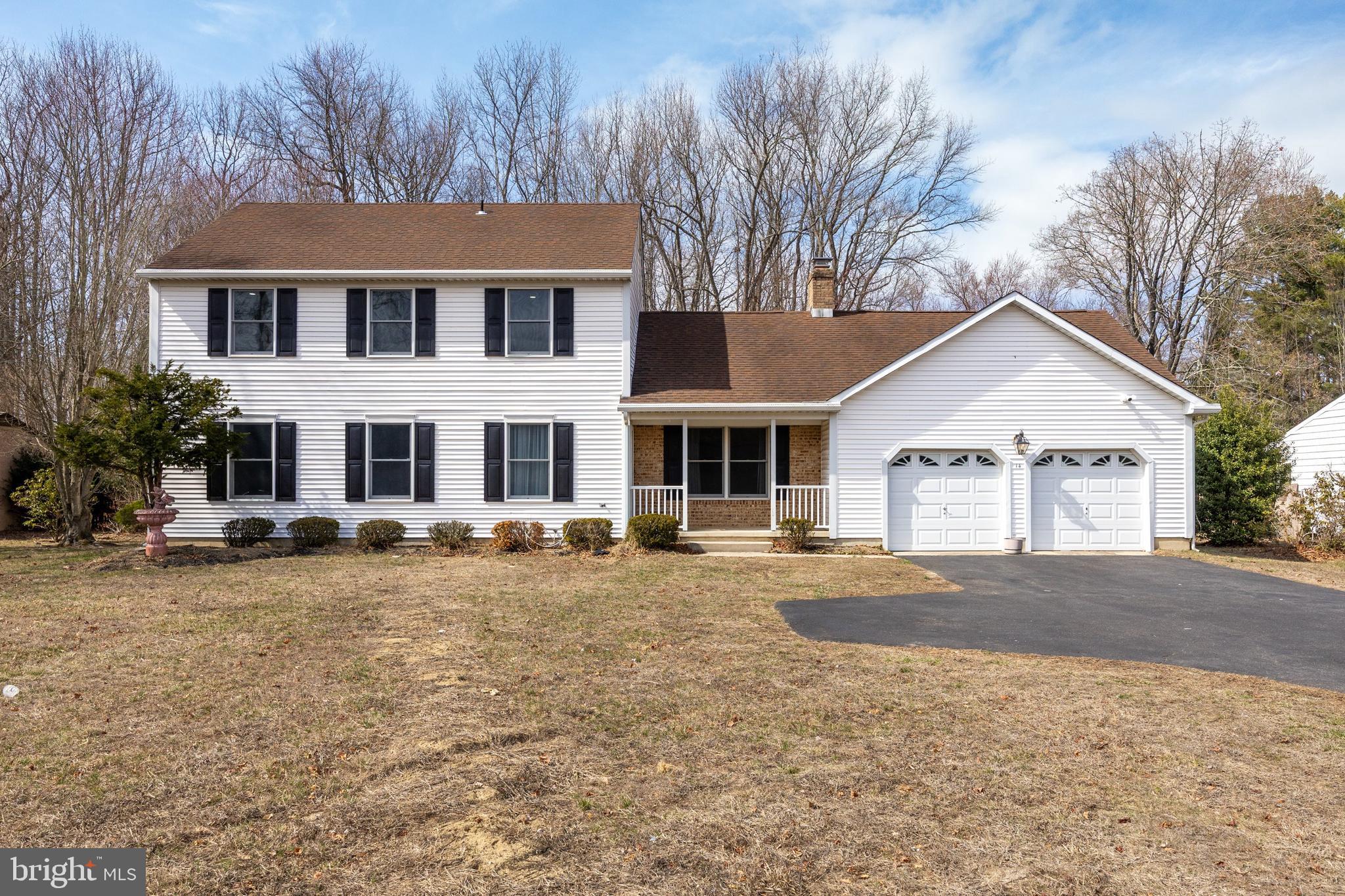 14 Taunton Road Medford, NJ 08055 - Photo 2 of 47 a view of a white house with a yard and large tree