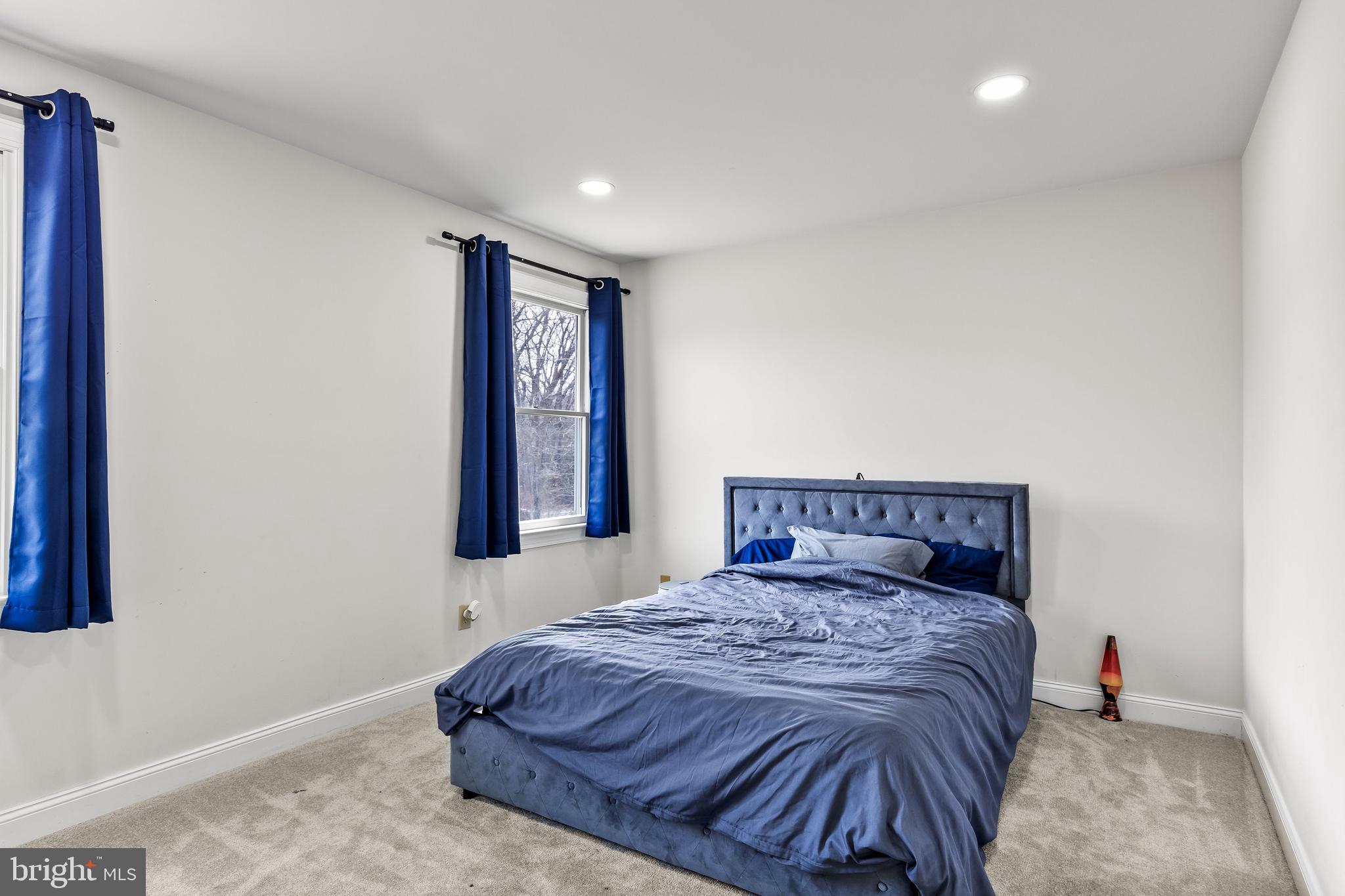 14 Taunton Road Medford, NJ 08055 - Photo 28 of 47 a bed sitting in a bedroom next to a window
