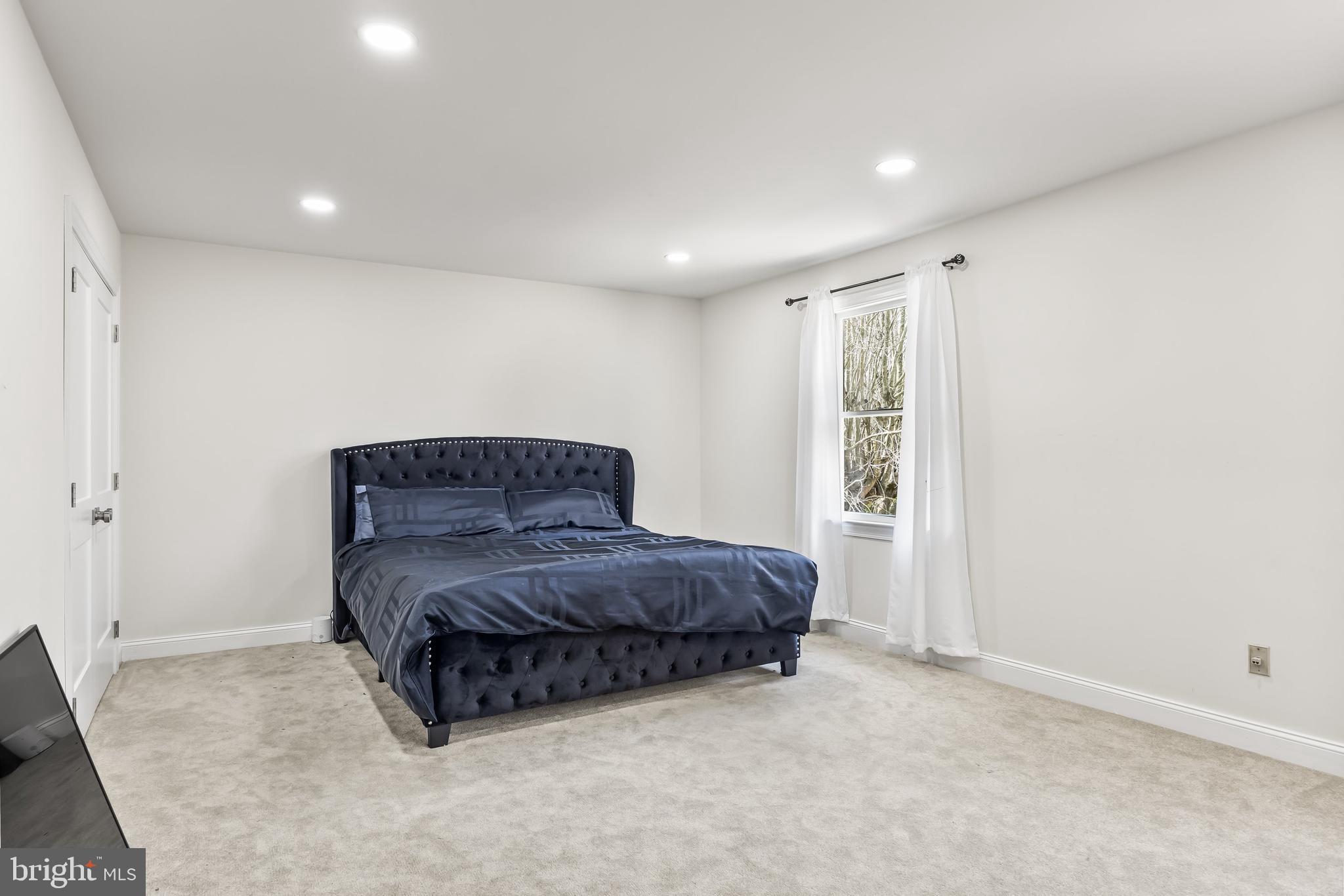 14 Taunton Road Medford, NJ 08055 - Photo 33 of 47 a spacious bedroom with a bed and a window