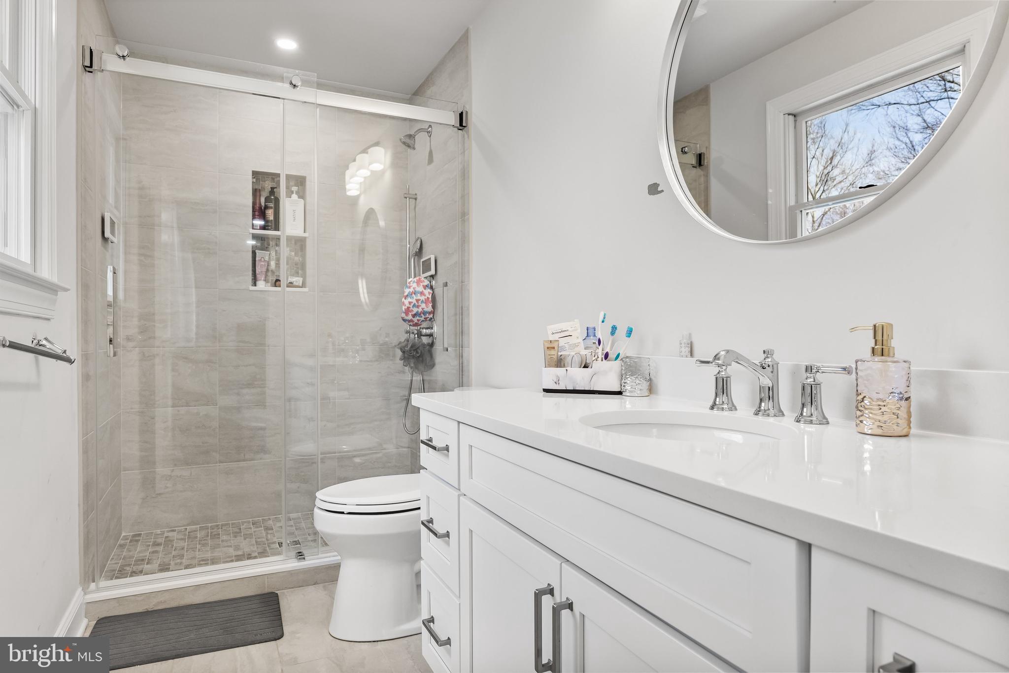 14 Taunton Road Medford, NJ 08055 - Photo 36 of 47 a bathroom with a granite countertop sink a toilet and a mirror