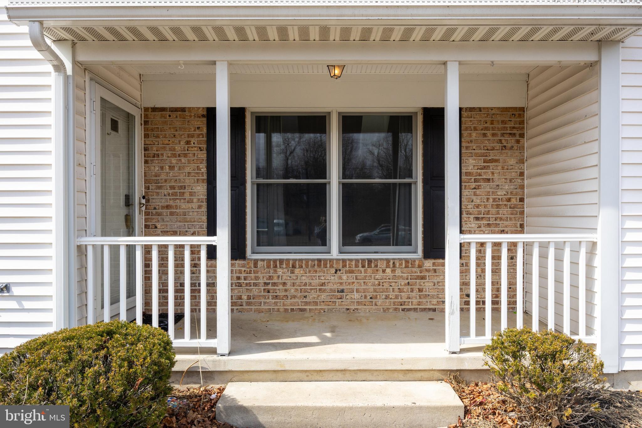 14 Taunton Road Medford, NJ 08055 - Photo 10 of 47 a view of a porch with a bench
