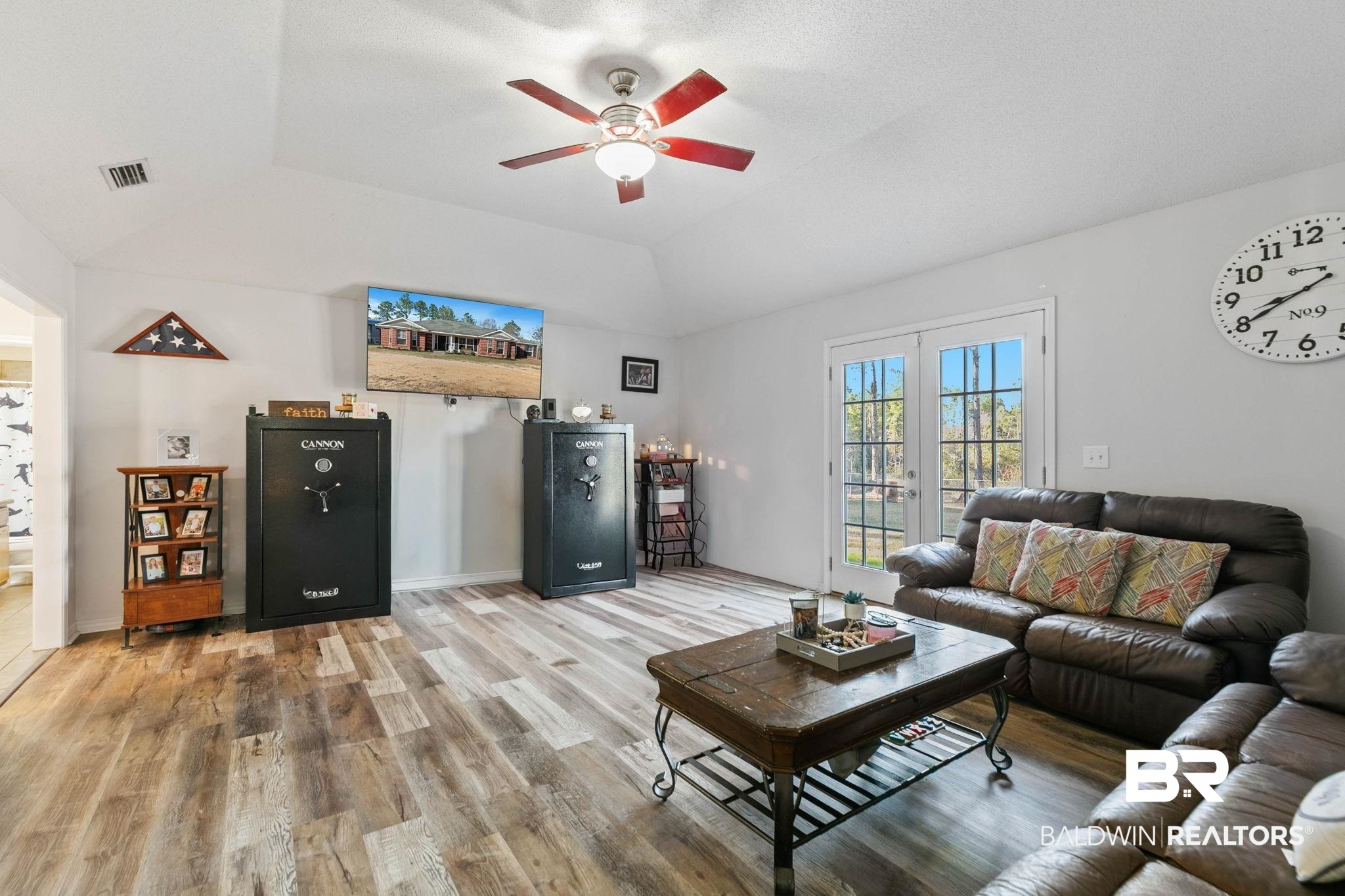 55750 Lottie Road Perdido, AL 36562 - Photo 70 of 84 Living room featuring french doors, vaulted ceiling, wood finished floors, and ceiling fan