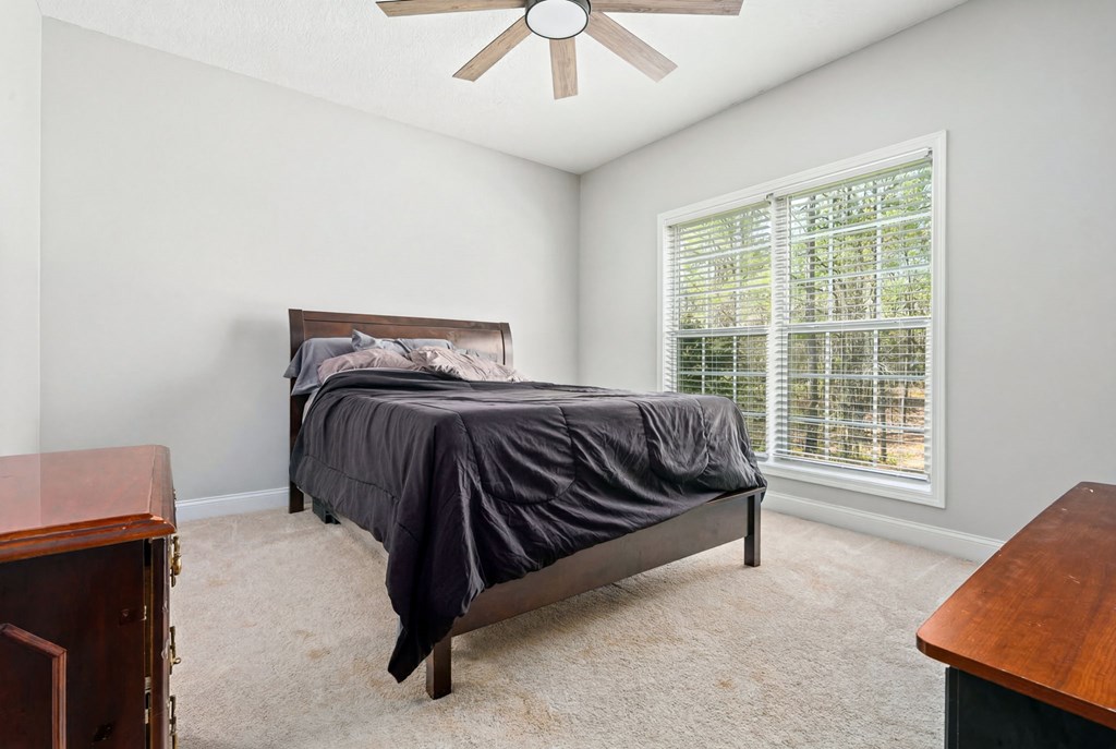 934 Ga Highway Fortson, GA 31808 - Photo 19 of 19 a bedroom with a bed and window