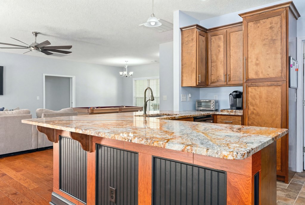 934 Ga Highway Fortson, GA 31808 - Photo 4 of 19 a kitchen with granite countertop a sink a counter top space and cabinets
