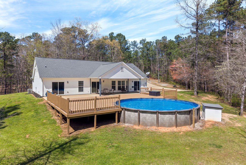 934 Ga Highway Fortson, GA 31808 - Photo 10 of 19 a aerial view of a house with swimming pool and deck