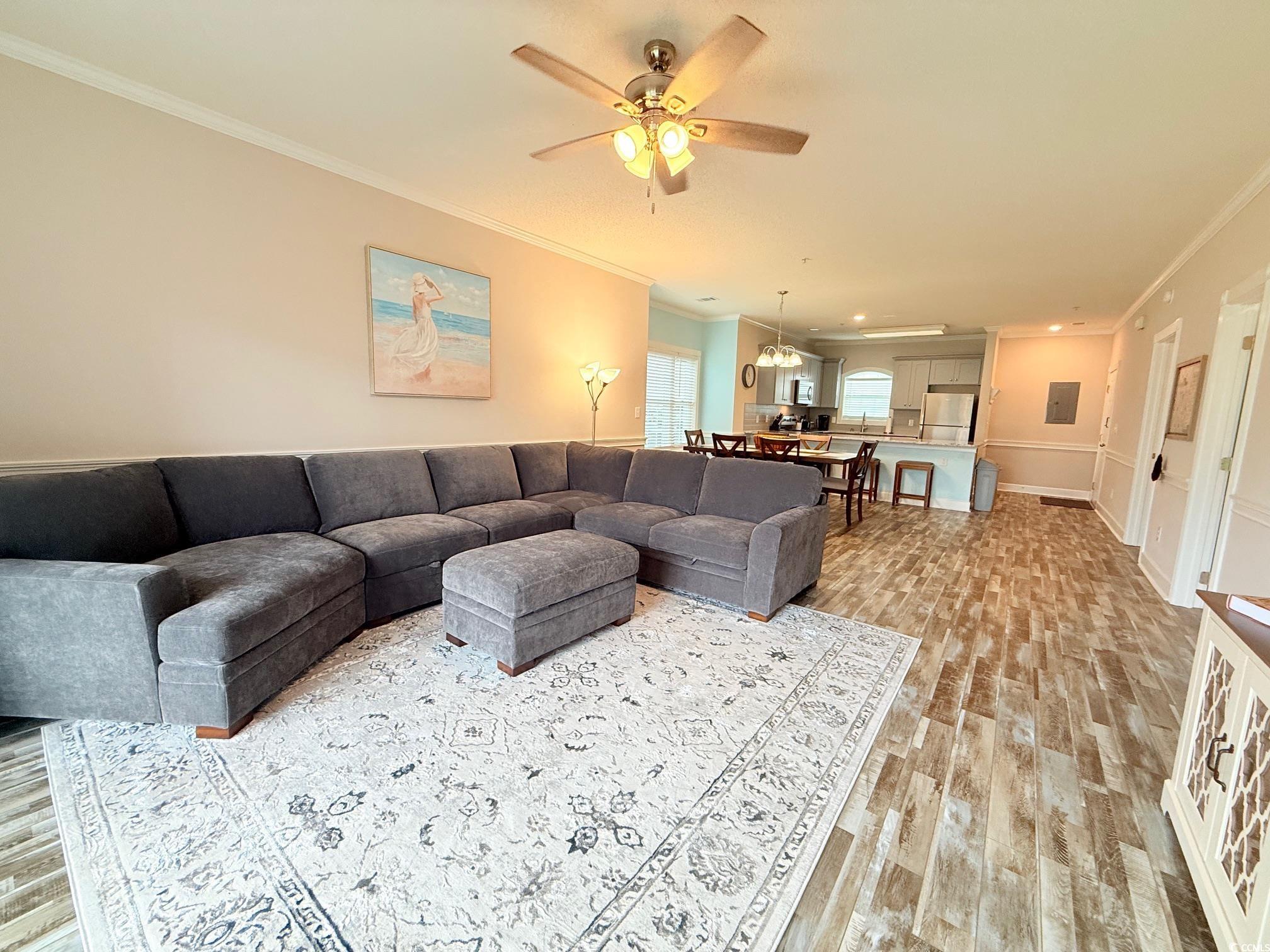 4860 Carnation Circle, Unit 17105 Myrtle Beach, SC 29577 - Photo 11 of 29 Living room featuring crown molding, light wood finished floors, and a ceiling fan