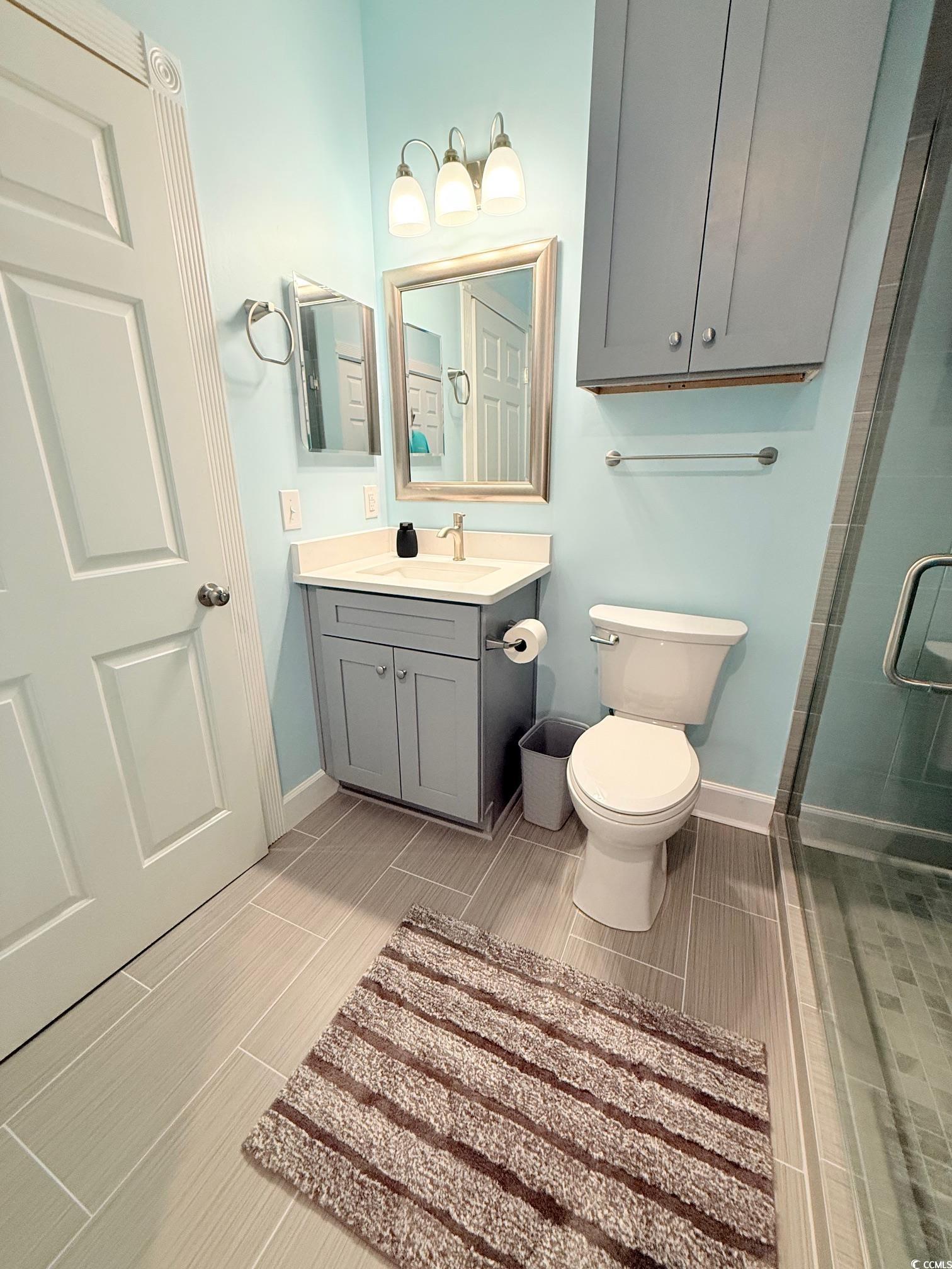 4860 Carnation Circle, Unit 17105 Myrtle Beach, SC 29577 - Photo 15 of 29 Full bathroom with vanity and a stall shower