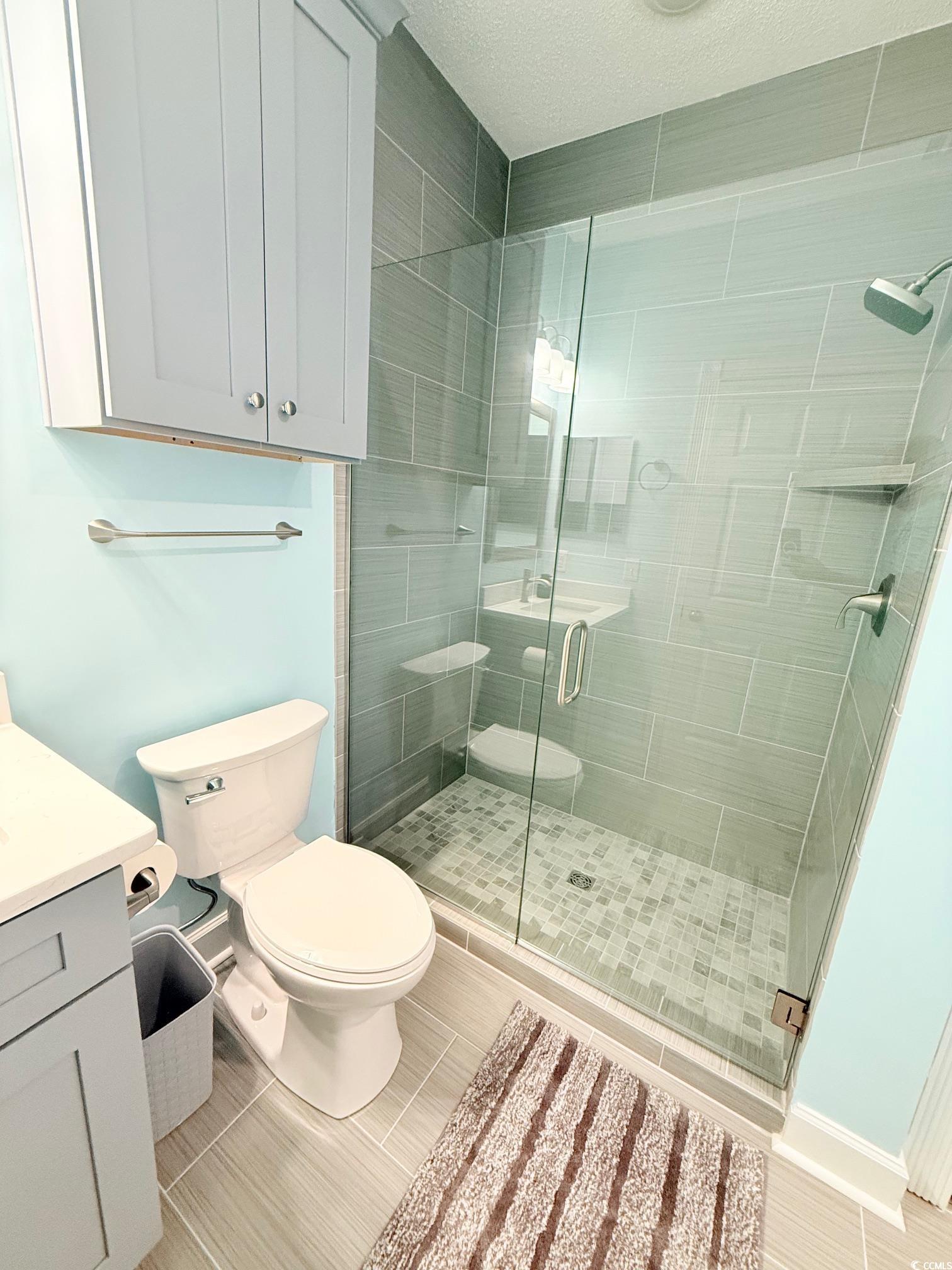 4860 Carnation Circle, Unit 17105 Myrtle Beach, SC 29577 - Photo 16 of 29 Bathroom with a shower stall and vanity