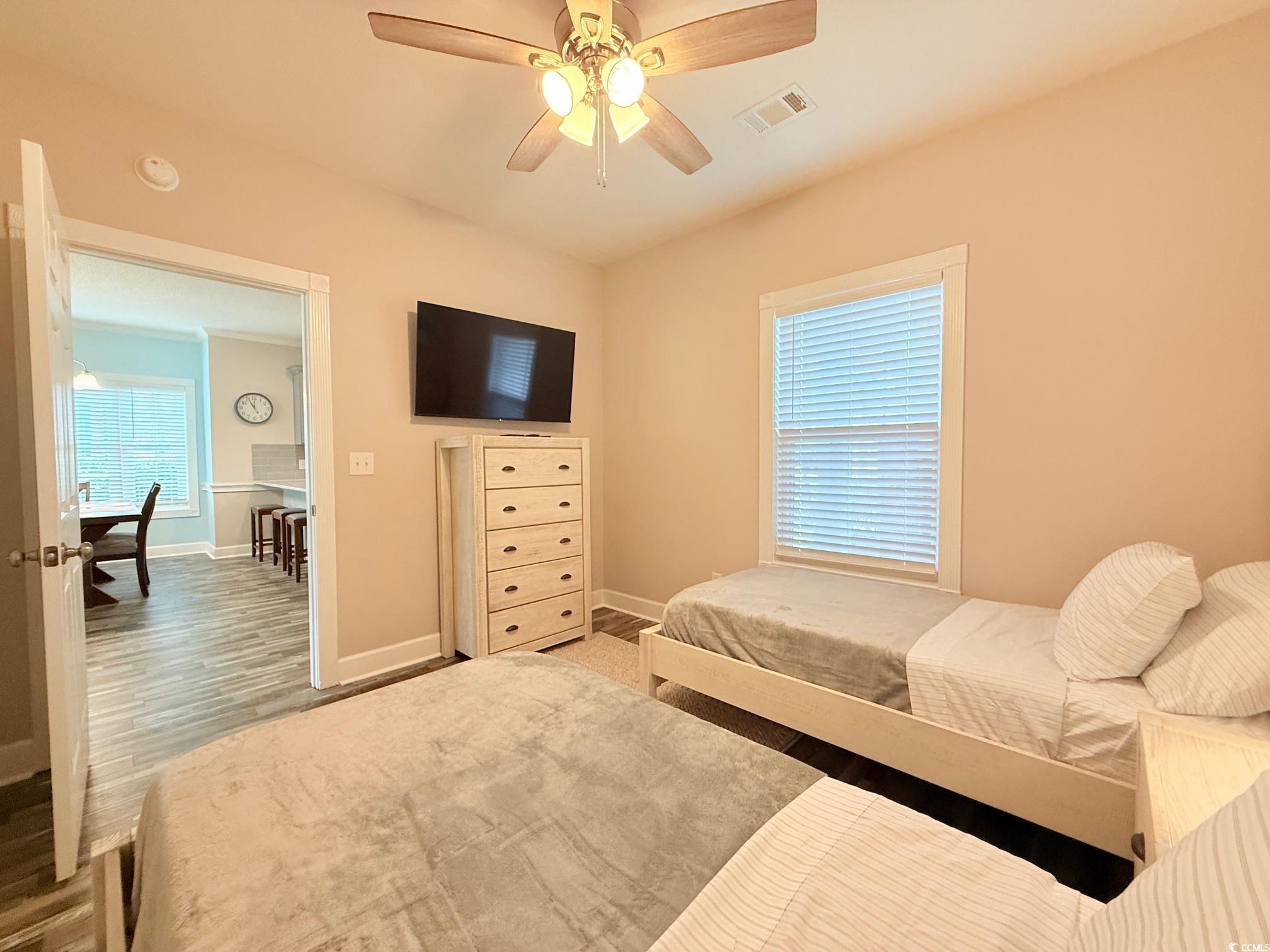 4860 Carnation Circle, Unit 17105 Myrtle Beach, SC 29577 - Photo 19 of 29 Bedroom with ceiling fan and wood finished floors