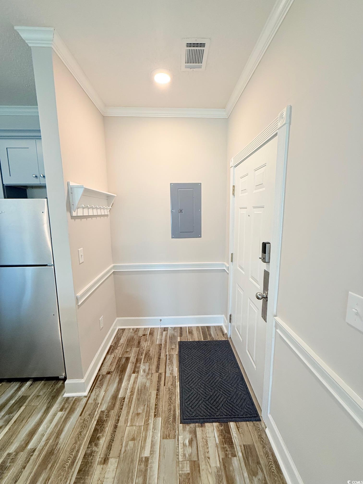 4860 Carnation Circle, Unit 17105 Myrtle Beach, SC 29577 - Photo 2 of 29 Doorway to outside featuring crown molding, wood finished floors, and electric panel
