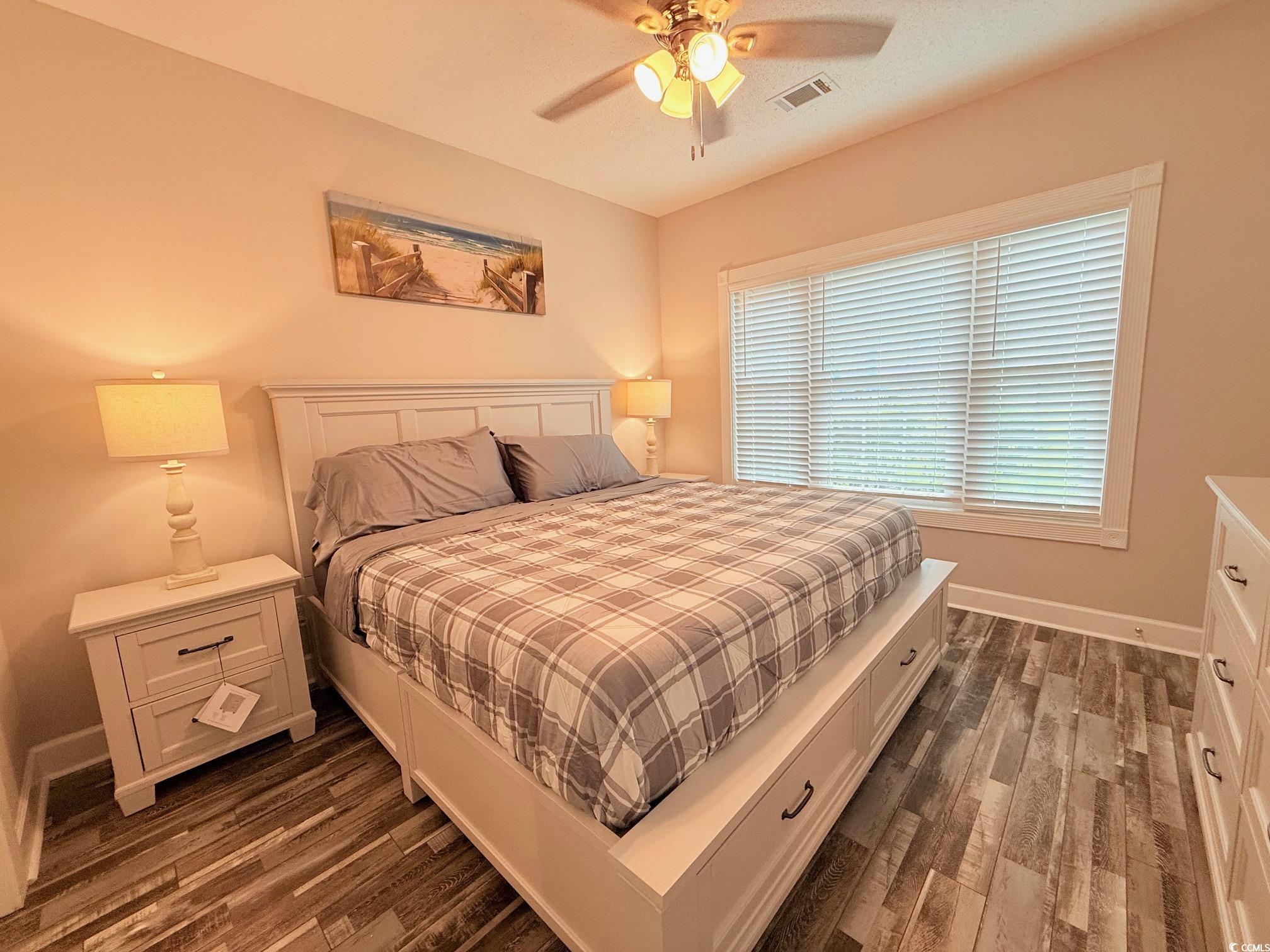 4860 Carnation Circle, Unit 17105 Myrtle Beach, SC 29577 - Photo 20 of 29 Bedroom featuring dark wood-type flooring and ceiling fan