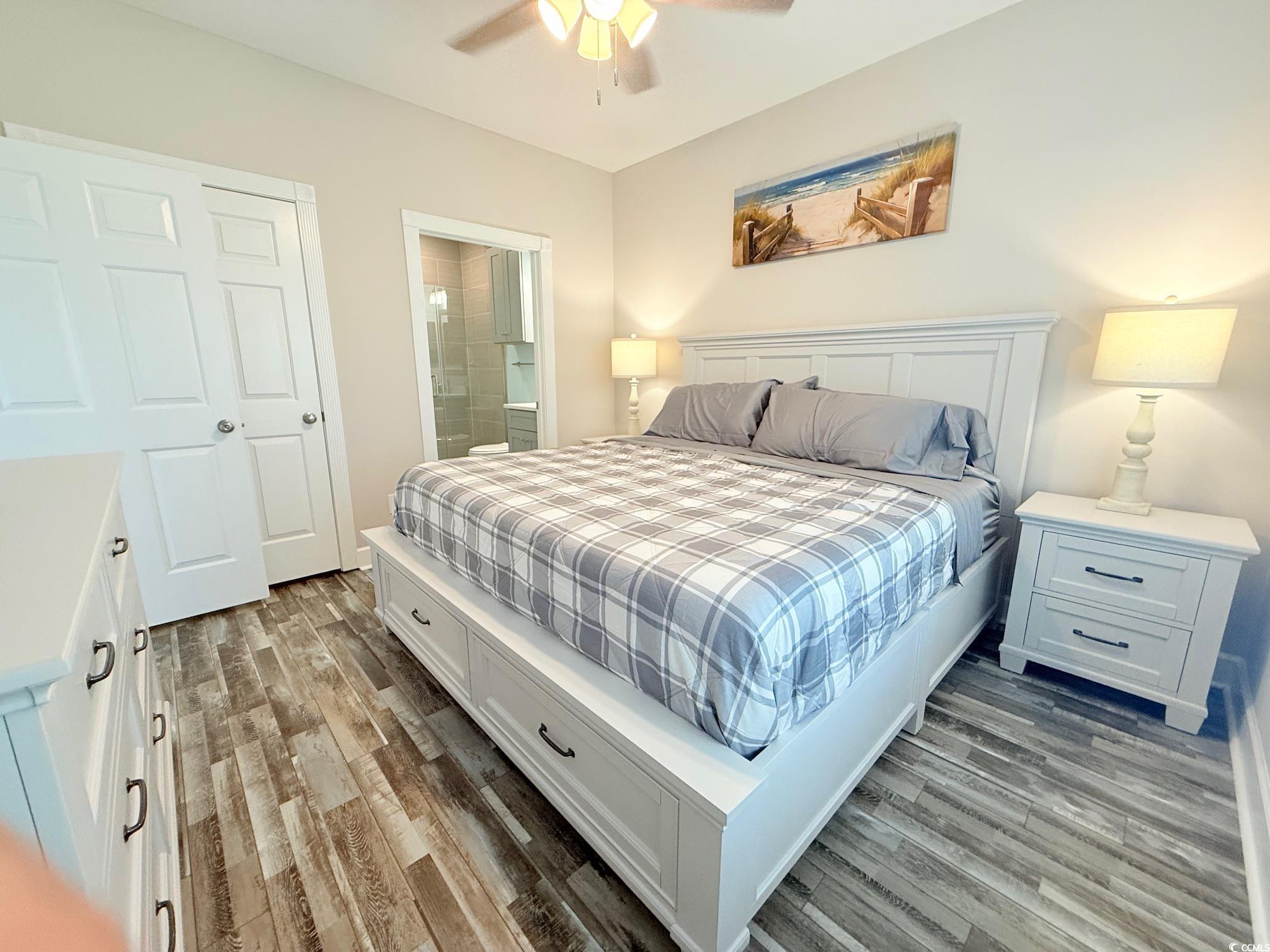 4860 Carnation Circle, Unit 17105 Myrtle Beach, SC 29577 - Photo 21 of 29 Bedroom with light wood-style flooring, connected bathroom, and ceiling fan