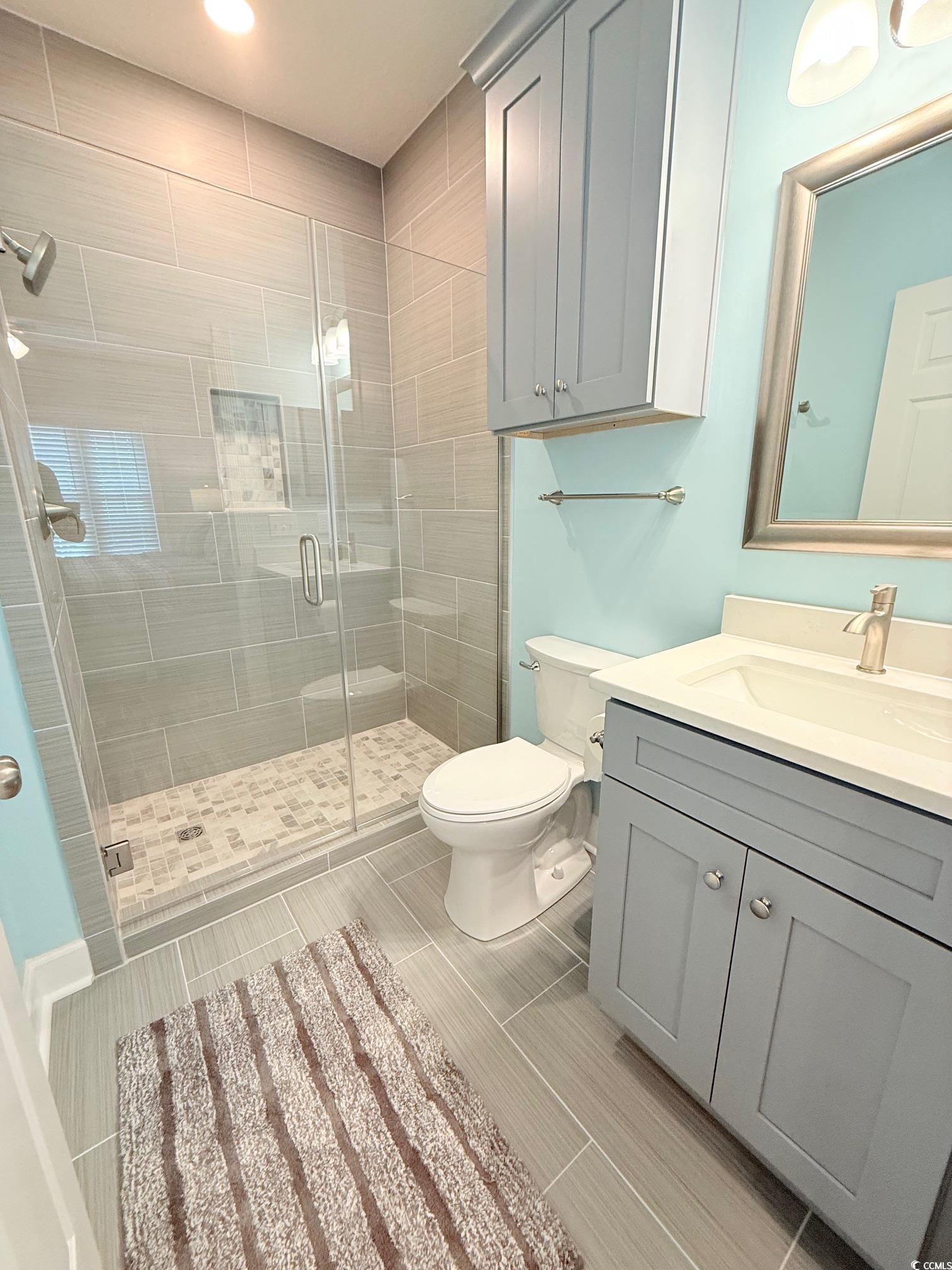 4860 Carnation Circle, Unit 17105 Myrtle Beach, SC 29577 - Photo 23 of 29 Bathroom with a shower stall and vanity